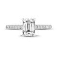 1.00 carat solitaire ring with an emerald cut diamond in white gold with side diamonds
