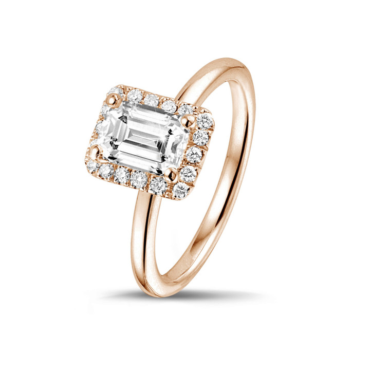1.00 carat solitaire halo ring with an emerald cut diamond in red gold with round diamonds