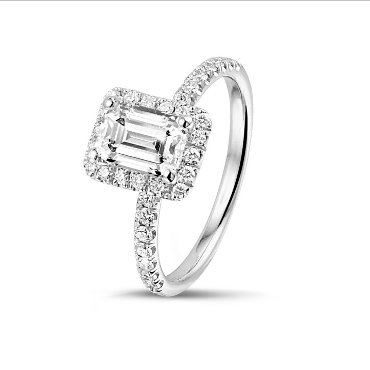 1.00 carat solitaire halo ring with an emerald cut diamond in white gold with round diamonds