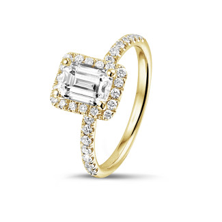 Rings - 1.00 carat solitaire halo ring with an emerald cut diamond in yellow gold with round diamonds