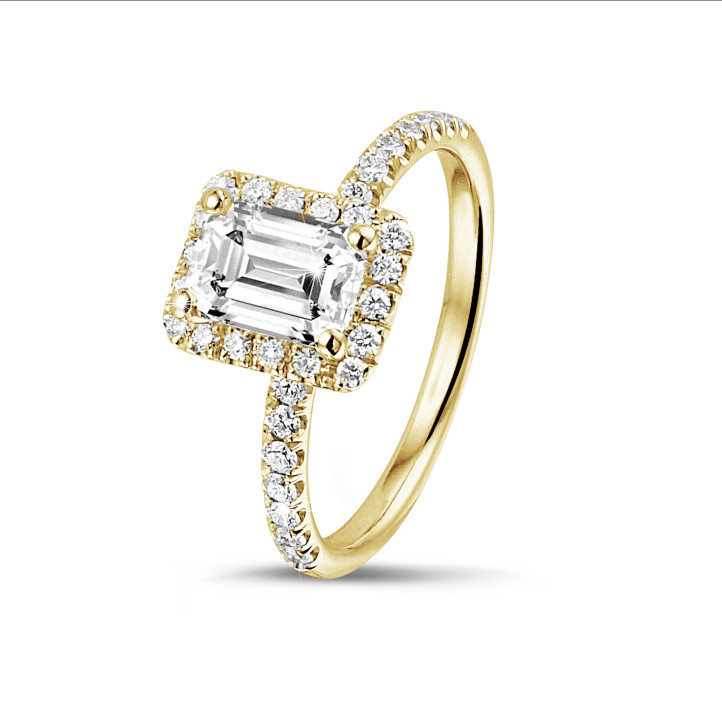 1.00 carat solitaire halo ring with an emerald cut diamond in yellow gold with round diamonds