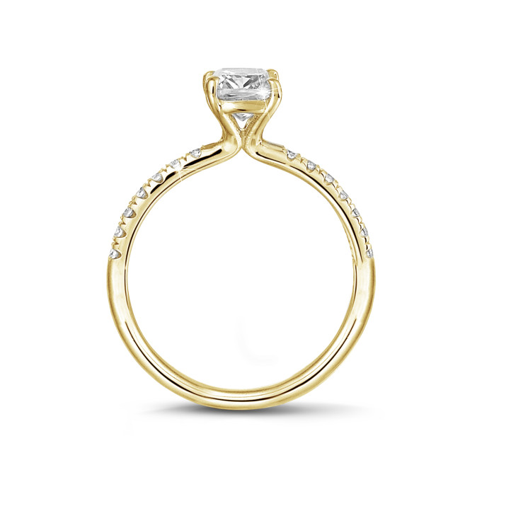 1.20 carat solitaire ring with an emerald cut diamond in yellow gold with side diamonds
