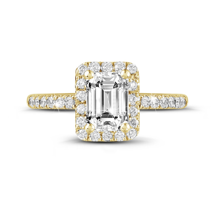 1.20 carat solitaire halo ring with an emerald cut diamond in yellow gold with round diamonds
