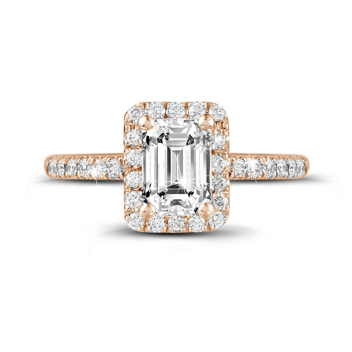 1.20 carat solitaire halo ring with an emerald cut diamond in red gold with round diamonds