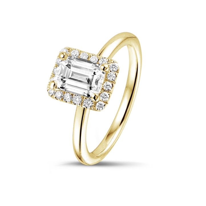 1.50 carat solitaire halo ring with an emerald cut diamond in yellow gold with round diamonds