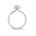 1.50 carat solitaire halo ring with an emerald cut diamond in white gold with round diamonds