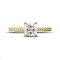 1.20 carat solitaire ring in yellow gold with princess diamond and side diamonds