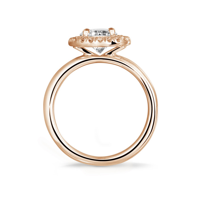 1.25 carat solitaire halo ring in red gold with round diamonds