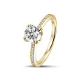 0.50 carat solitaire ring in yellow gold with side diamonds