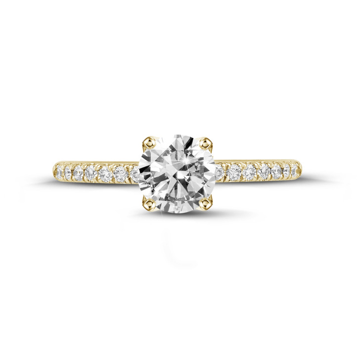 0.70 carat solitaire ring in yellow gold with side diamonds