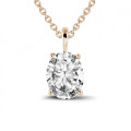 0.70 carat solitaire pendant in red gold with oval diamond