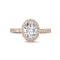 1.20Ct halo ring in red gold with oval diamond