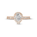 0.70Ct halo ring in red gold with pear diamond