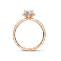 1.00Ct halo ring in red gold with pear diamond