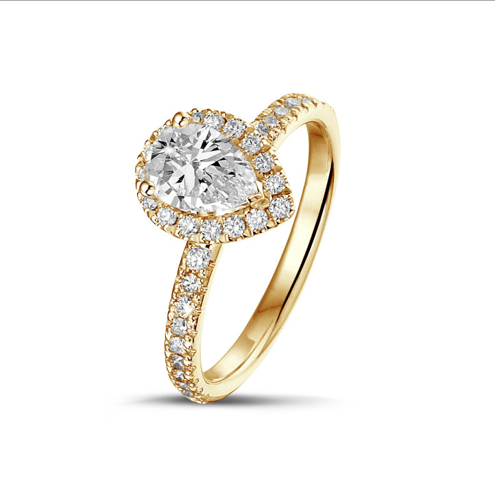 0.70Ct halo ring in yellow gold with pear diamond