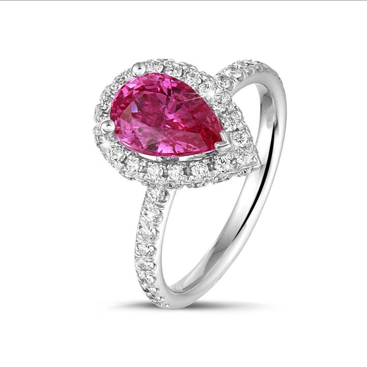 Halo ring in white gold with a pink, pear cut sapphire and round diamonds