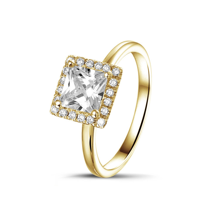 0.70 carat solitaire halo ring with a princess diamond in yellow gold with round diamonds