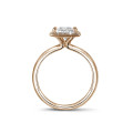 0.70 carat solitaire halo ring with a princess diamond in red gold with round diamonds