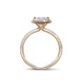 1.50 carat solitaire halo ring with a princess diamond in red gold with round diamonds