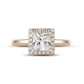2.00 carat solitaire halo ring with a princess diamond in red gold with round diamonds