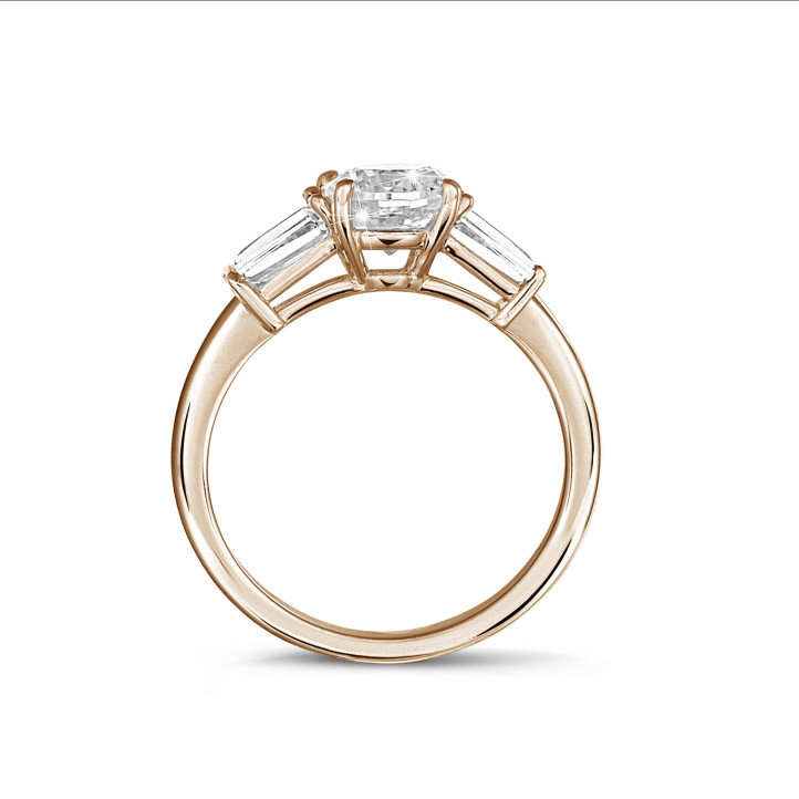 1.00 carat trilogy ring in red gold with a round diamond and tapered baguettes