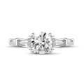 1.00 carat trilogy ring in platinum with a round diamond and tapered baguettes