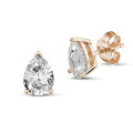 2.00 carat solitaire pear cut diamond earrings in red gold