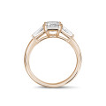 1.00 carat trilogy ring in red gold with a princess diamond and tapered baguettes