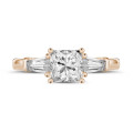 1.00 carat trilogy ring in red gold with a princess diamond and tapered baguettes