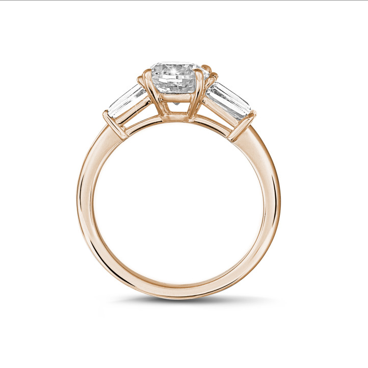 1.00 carat trilogy ring in red gold with a cushion diamond and tapered baguettes