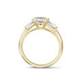 1.00 carat trilogy ring in yellow gold with pear diamond and tapered baguettes