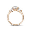 1.00 carat trilogy ring in red gold with pear diamond and tapered baguettes