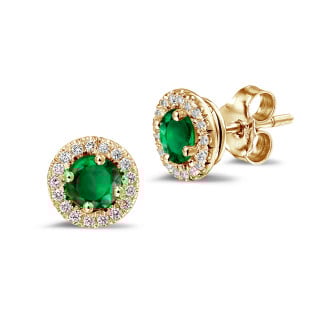 Diamond halo earrings in yellow gold with emerald