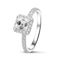 2.00 carat solitaire halo ring with an asscher cut diamond in white gold and round diamonds