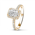 0.70 carat solitaire halo ring with a radiant cut diamond in red gold with round diamonds