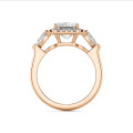 Bespoke trilogy ring with an emerald cut diamond and side pear cut diamonds