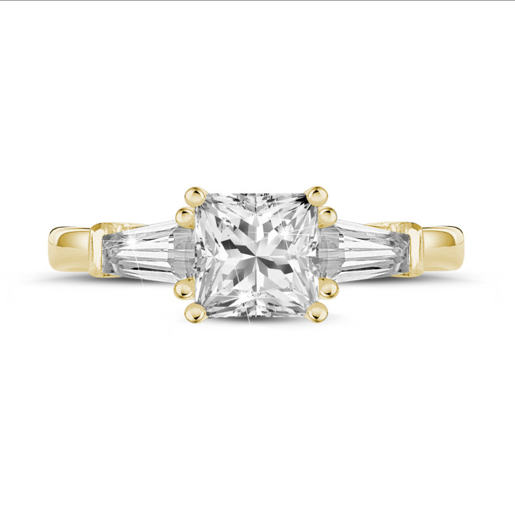 1.50 carat trilogy ring in yellow gold with a princess diamond and tapered baguettes