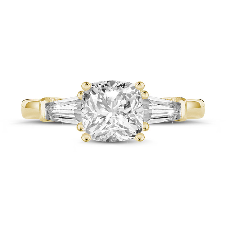 1.50 carat trilogy ring in yellow gold with a cushion diamond and tapered baguettes