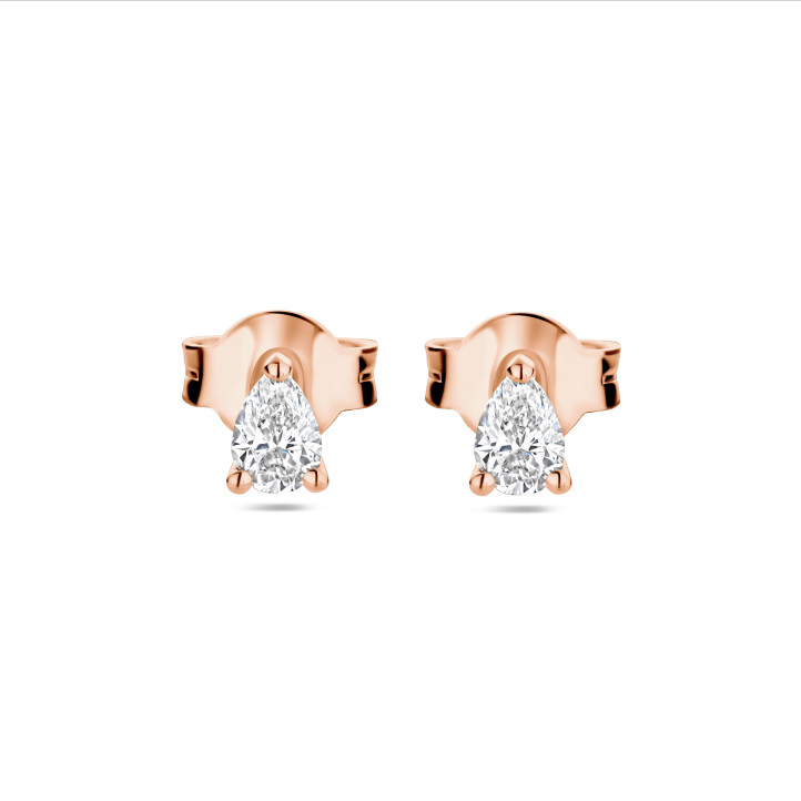 0.30 carat solitaire earrings with pear cut diamonds in red gold
