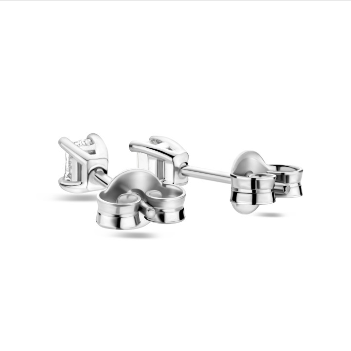 0.30 carat solitaire earrings with emerald cut diamonds in white gold
