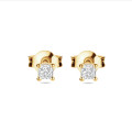 0.30 carat solitaire earrings with cushion cut diamonds in yellow gold