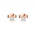0.30 carat solitaire earrings with cushion cut diamonds in red gold