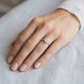 2.00 carat solitaire halo ring with an asscher cut diamond in white gold and round diamonds