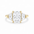 Bespoke trilogy ring with a radiant  cut diamond