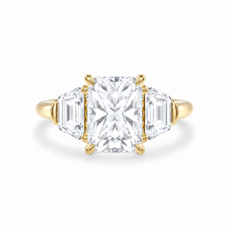 Bespoke trilogy ring with a radiant  cut diamond
