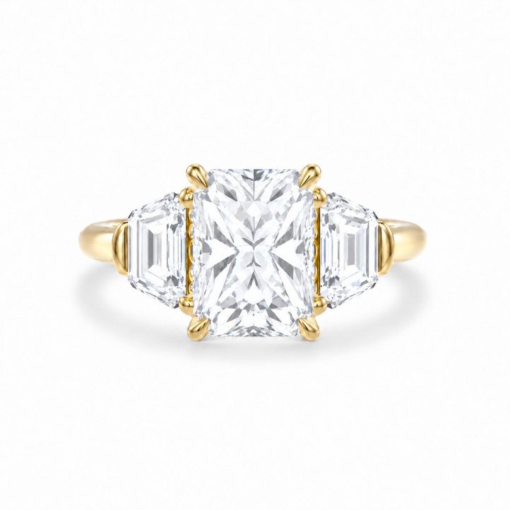 Bespoke trilogy ring with a radiant  cut diamond