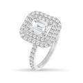 Bespoke emerald cut diamond ring with a double halo