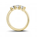 0.75 carat trilogy ring in yellow gold with round diamonds