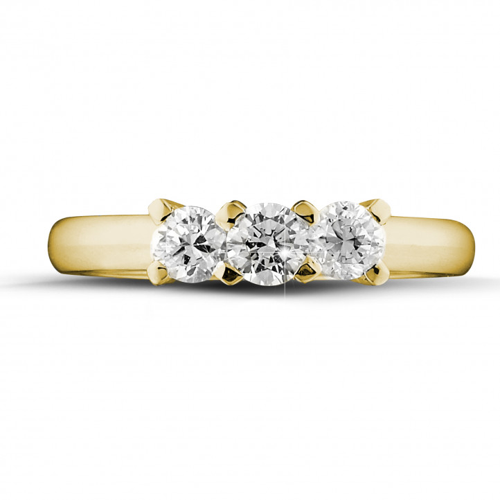 0.75 carat trilogy ring in yellow gold with round diamonds