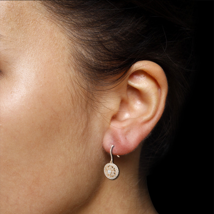 0.50 carat diamond earrings in red gold